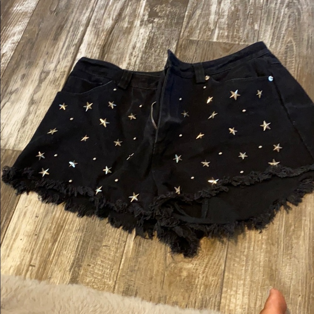 Star studded black denim shorts